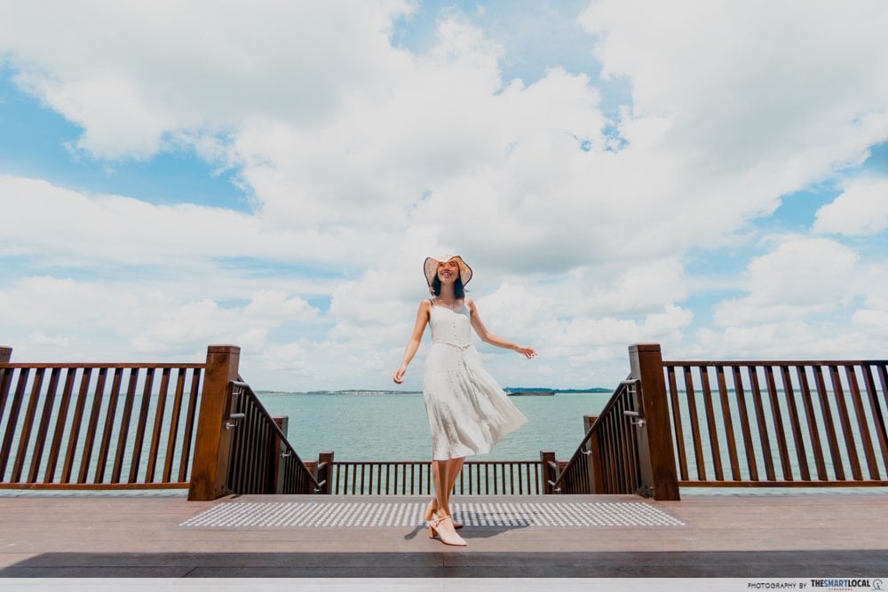 posing with boardwalk view